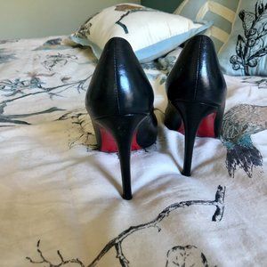 Christian Louboutin red-bottom black leather pumps